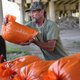 A man fills sandbags as he prepares for the arrival of Marco and Laura on August 24, 2020 in Morgan City , Louisiana.